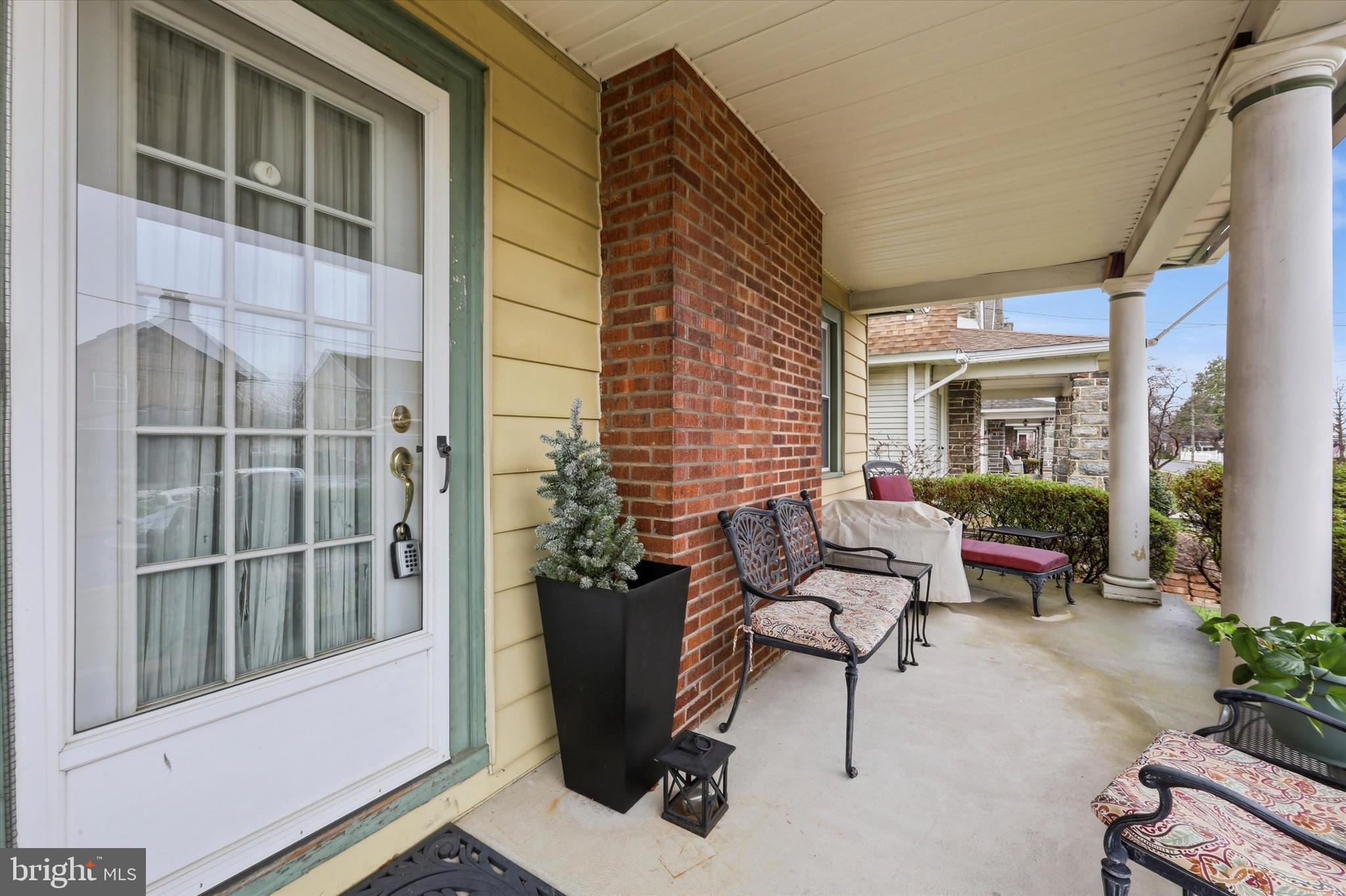 148 Sycamore Road Havertown, PA 19083 - Photo 5 of 29 a building outdoor space with patio furniture