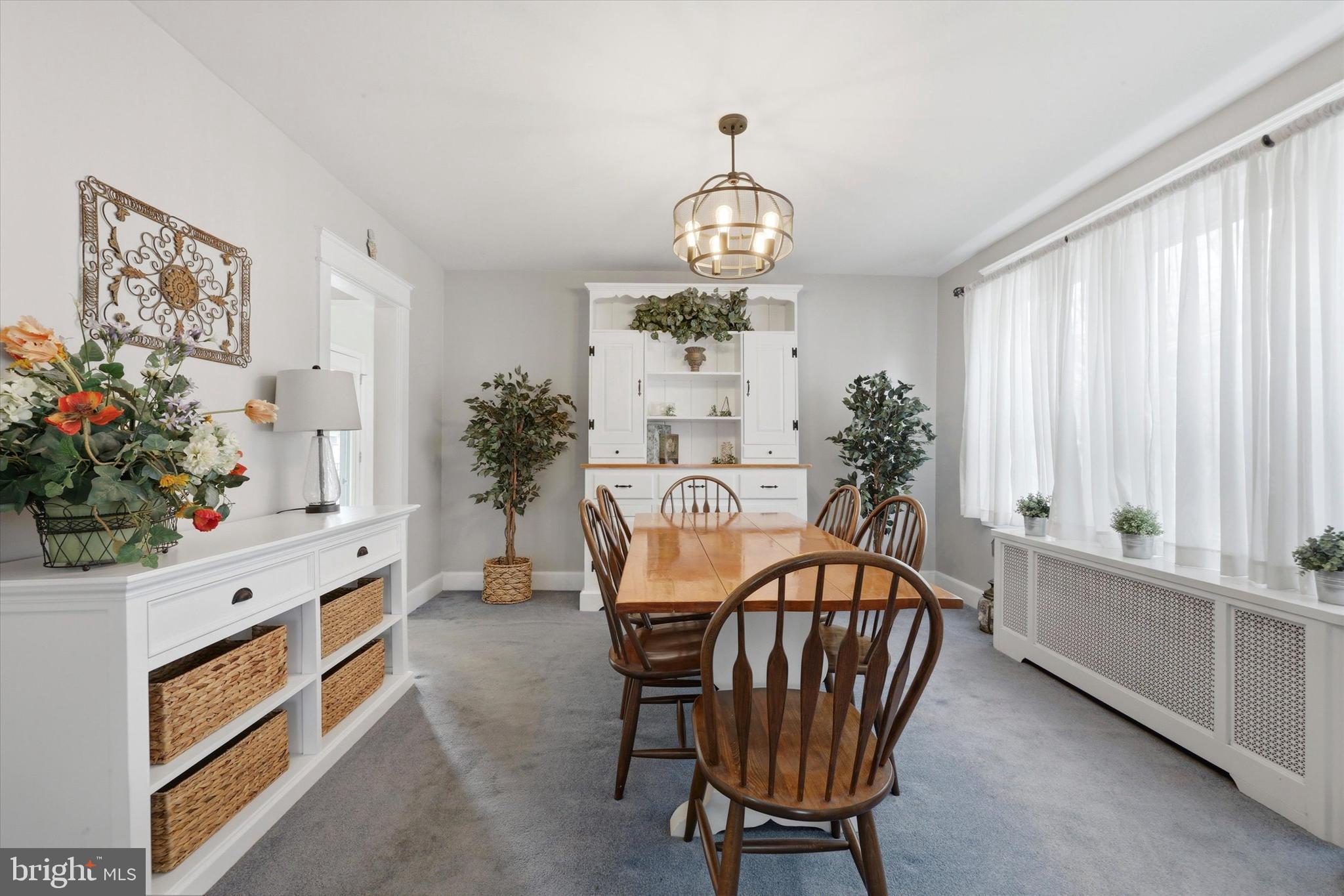 148 Sycamore Road Havertown, PA 19083 - Photo 9 of 29 a view of a dining room with furniture and chandelier