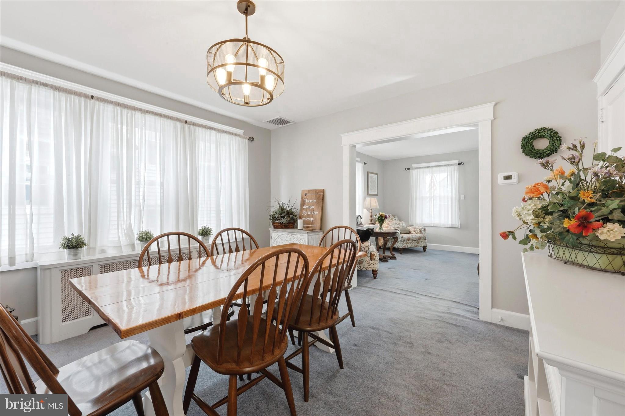 148 Sycamore Road Havertown, PA 19083 - Photo 10 of 29 a view of a dining room and livingroom with furniture window and wooden floor