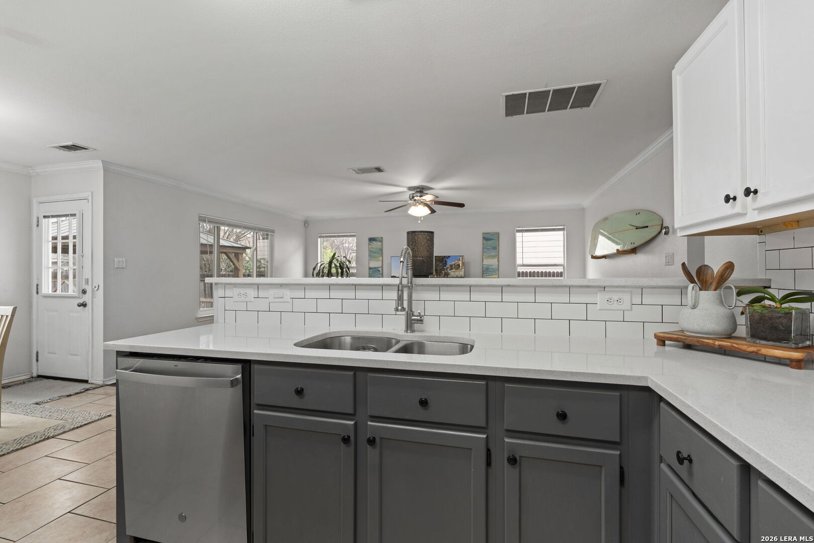11911 Ghost Bridge Helotes, TX 78023 - Photo 19 of 47 a kitchen with a sink and cabinets