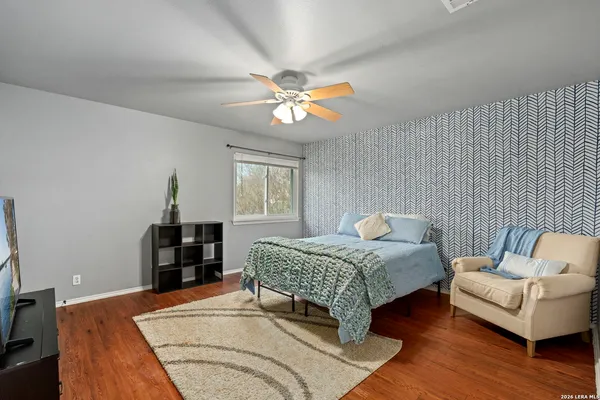 a bathroom with a double vanity sink mirror and bathtub