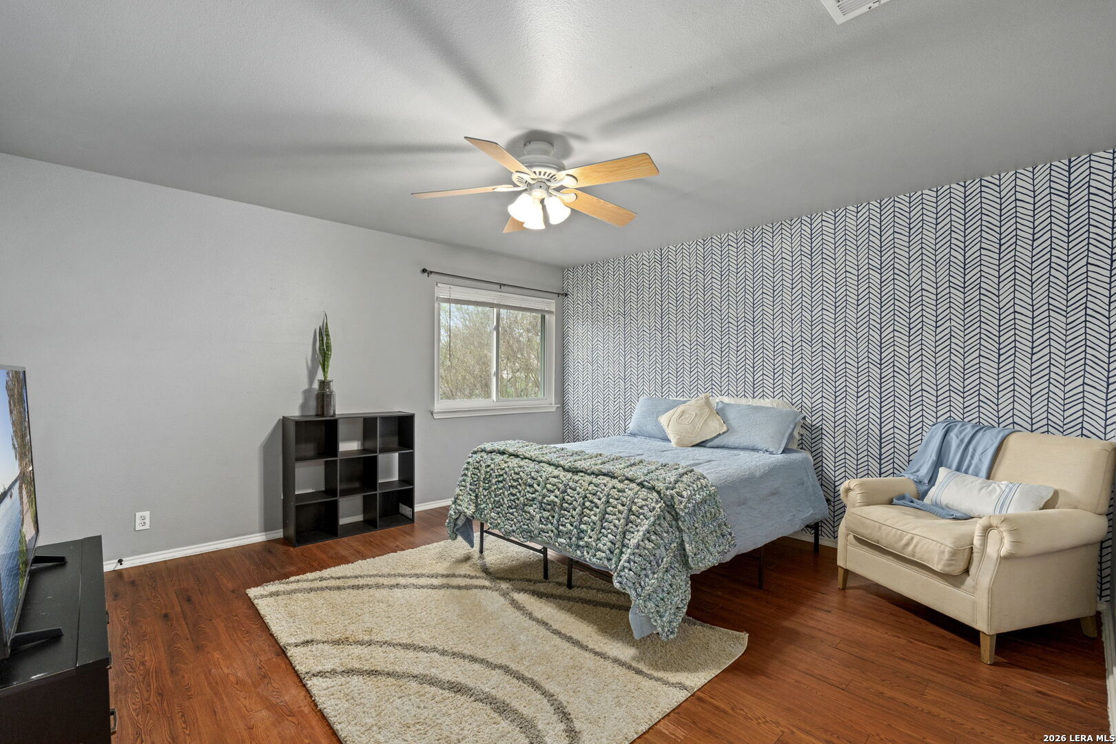 11911 Ghost Bridge Helotes, TX 78023 - Photo 23 of 47 a bedroom with a bed and window