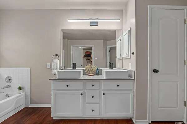 a bathroom with a bathtub and a shower
