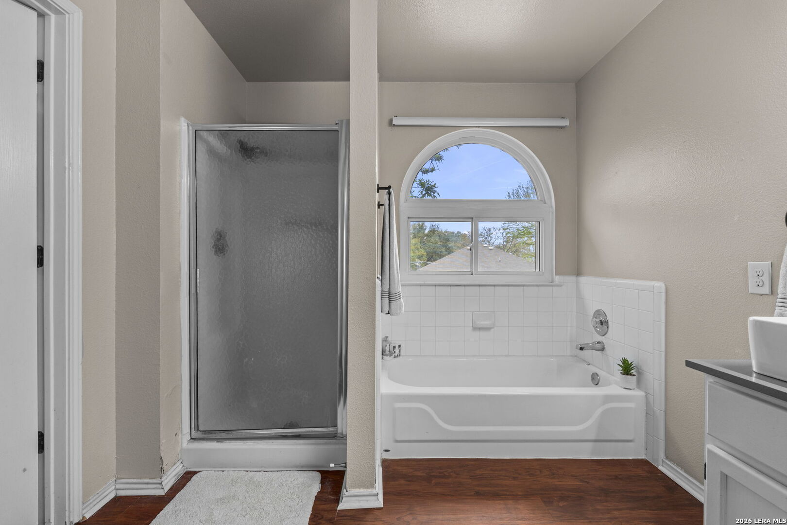 11911 Ghost Bridge Helotes, TX 78023 - Photo 27 of 47 a bathroom with a bathtub and a shower