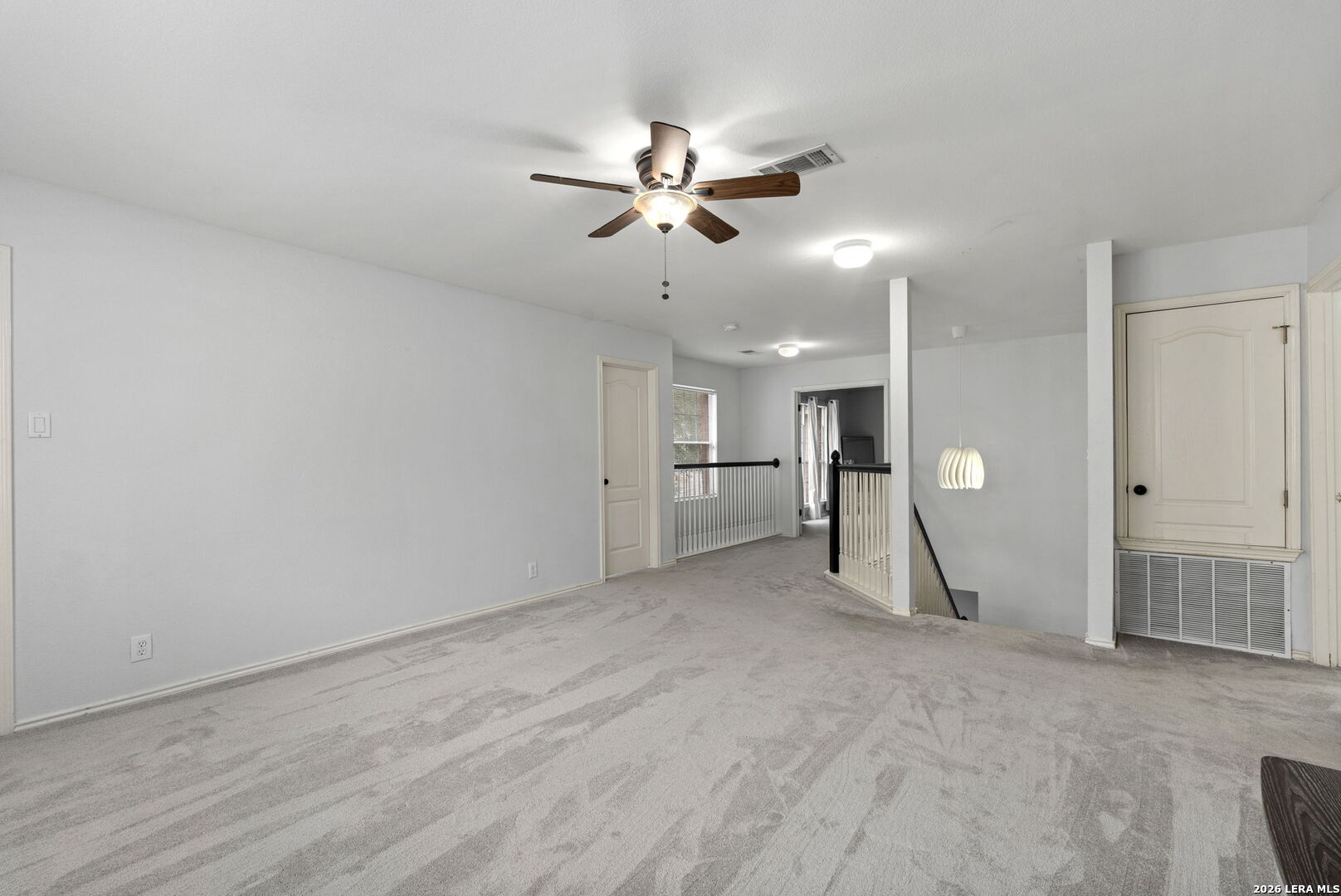 11911 Ghost Bridge Helotes, TX 78023 - Photo 30 of 47 a view of an empty room and kitchen view