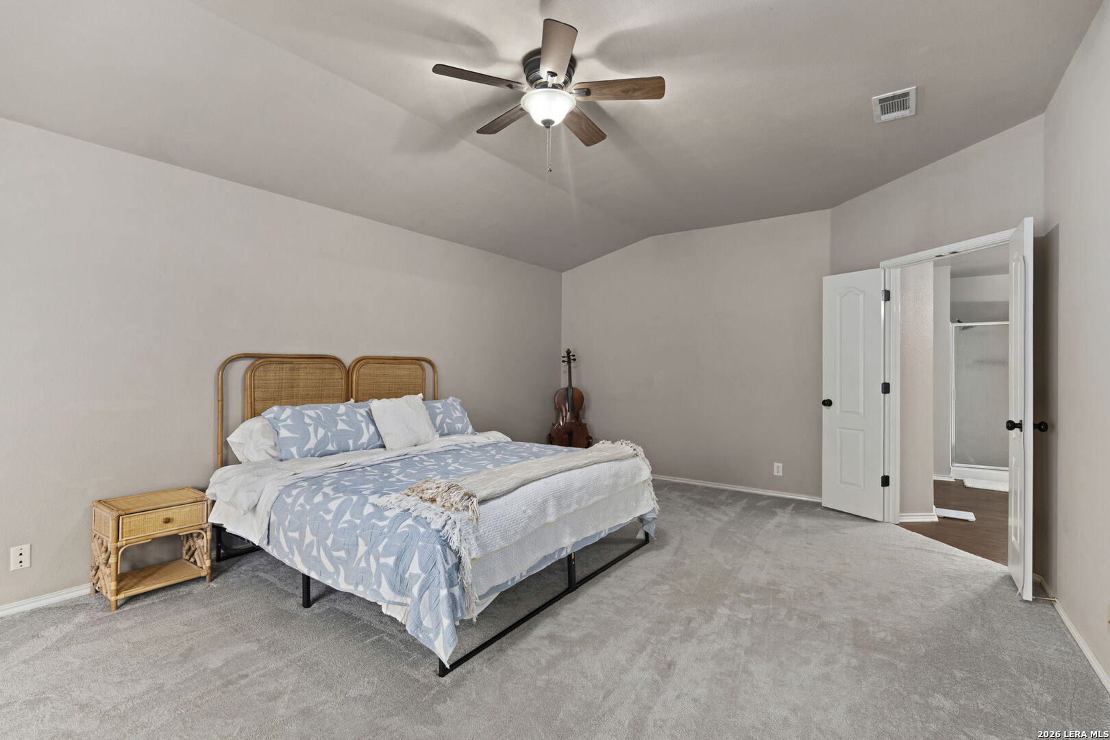 11911 Ghost Bridge Helotes, TX 78023 - Photo 33 of 47 a bedroom with a bed and a ceiling fan