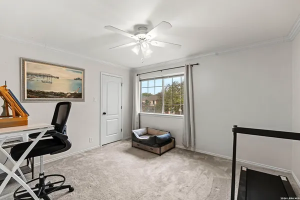 a view of a livingroom with furniture hardwood floor and a ceiling fan