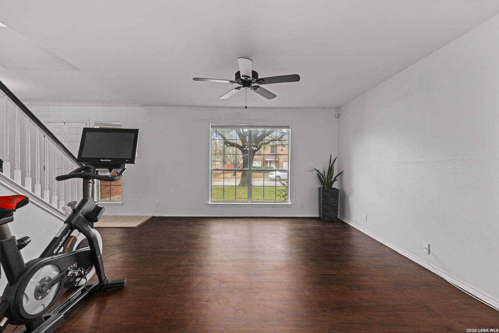 11911 Ghost Bridge Helotes, TX 78023 - Photo 37 of 47 a view of a livingroom with furniture hardwood floor and a ceiling fan