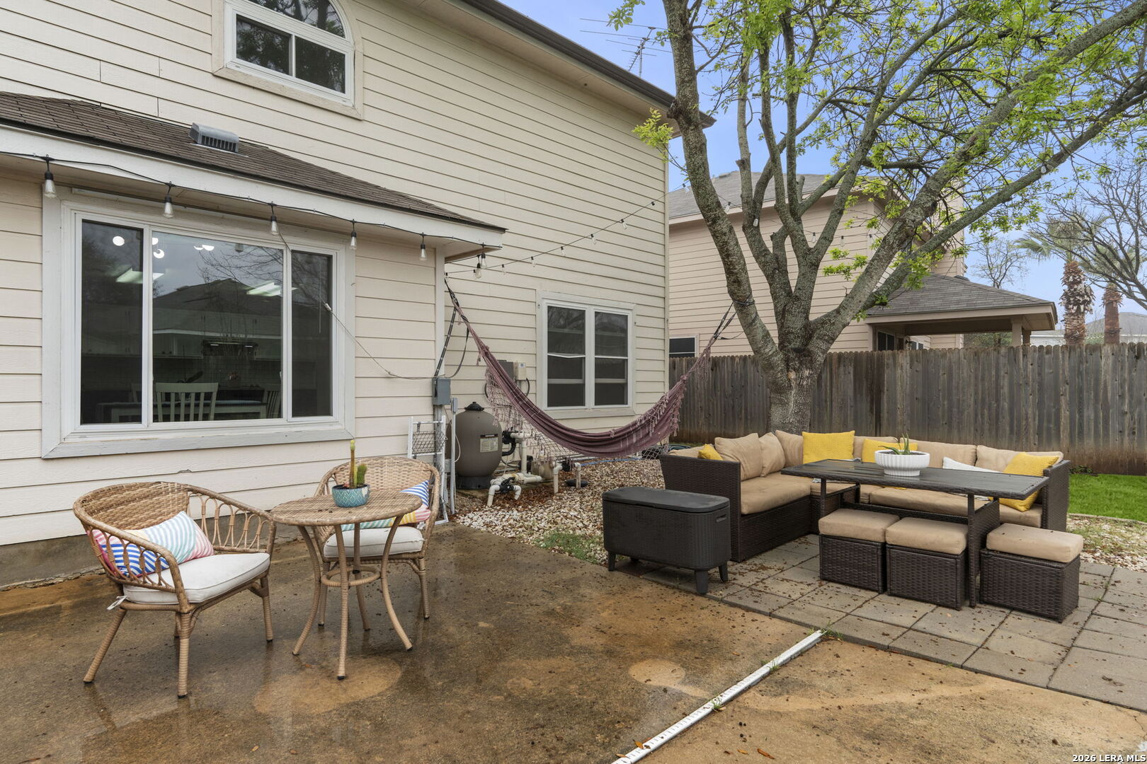 11911 Ghost Bridge Helotes, TX 78023 - Photo 42 of 47 a backyard of a house with barbeque oven table and chairs