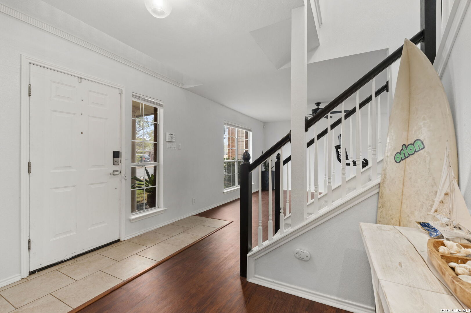 11911 Ghost Bridge Helotes, TX 78023 - Photo 7 of 47 a view of entryway with wooden floor and stairs