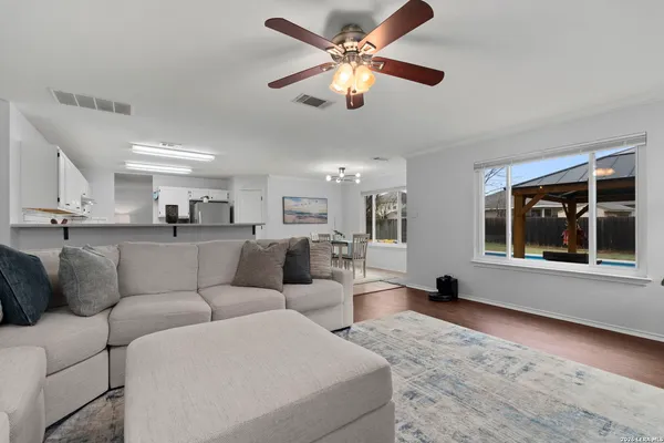 a living room with furniture and a table