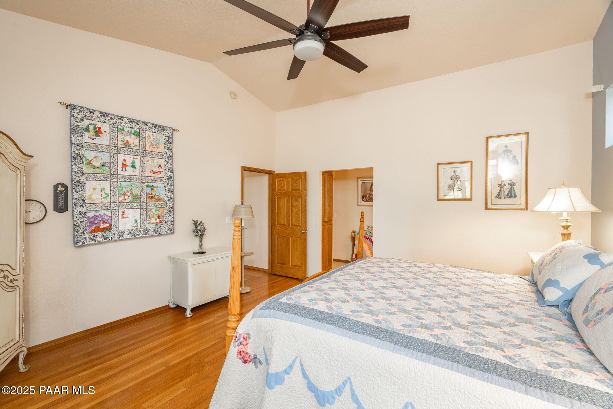 11452 East Turquoise Circle Dewey, AZ 86327 - Photo 16 of 68 a bedroom with a bed and wooden floor