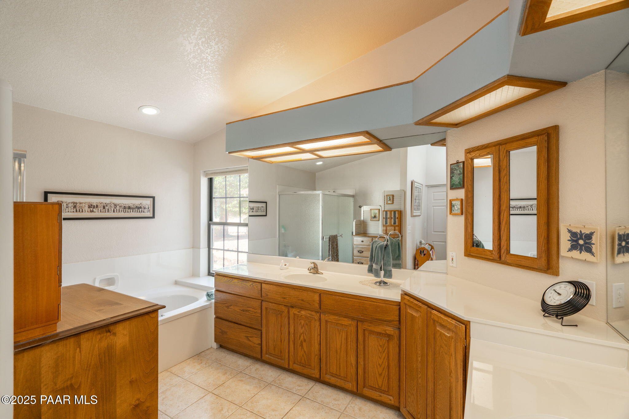 11452 East Turquoise Circle Dewey, AZ 86327 - Photo 17 of 68 a bathroom with a tub sink and mirror