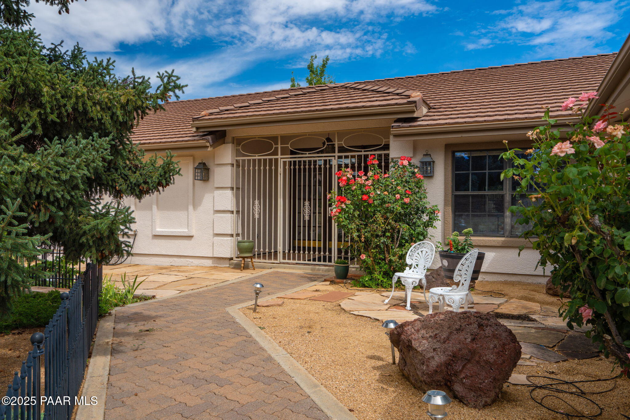 11452 East Turquoise Circle Dewey, AZ 86327 - Photo 2 of 68 a view of a house with potted plants and a table and chairs