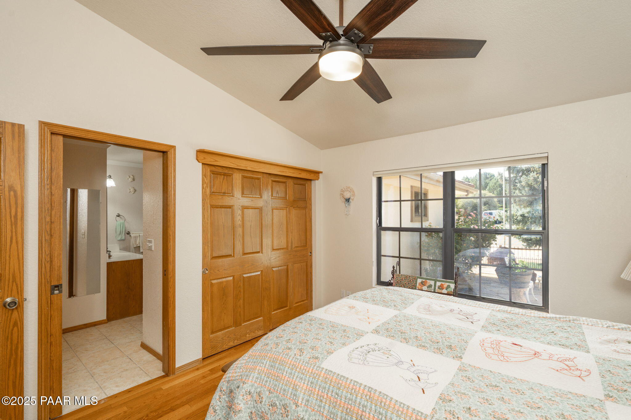 11452 East Turquoise Circle Dewey, AZ 86327 - Photo 21 of 68 a bedroom with a bed and a large window