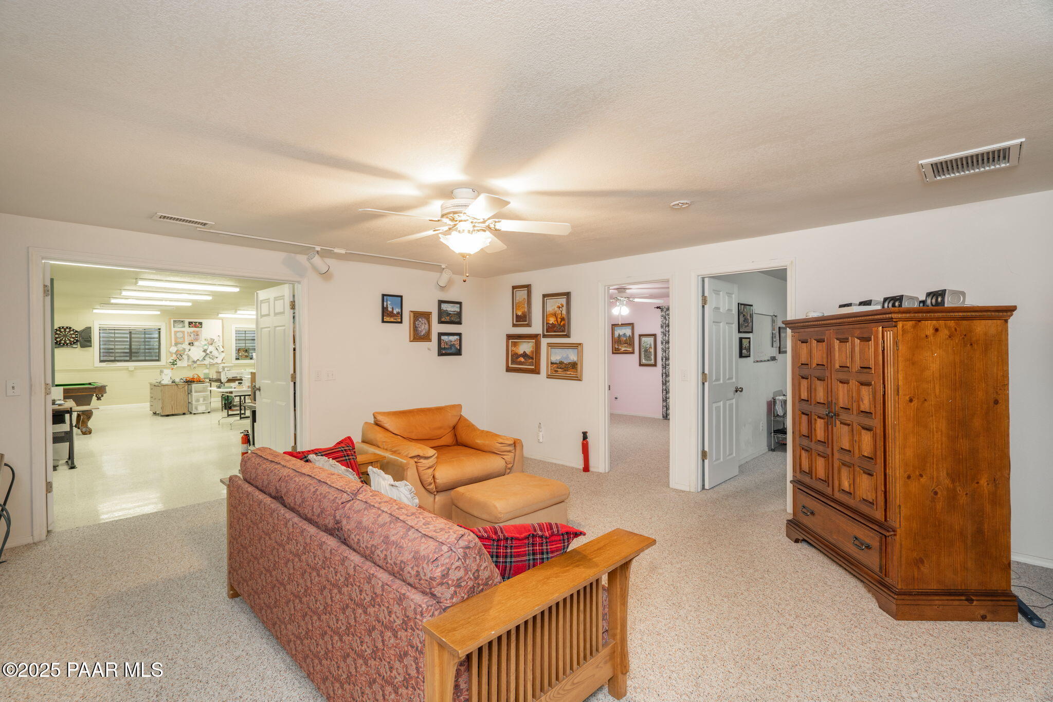 11452 East Turquoise Circle Dewey, AZ 86327 - Photo 23 of 68 a living room with furniture and a chandelier