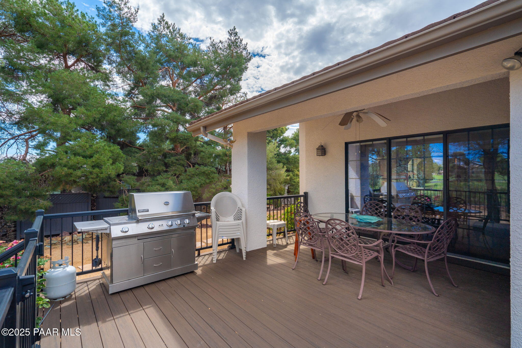 11452 East Turquoise Circle Dewey, AZ 86327 - Photo 37 of 68 a view of a patio with table and chairs
