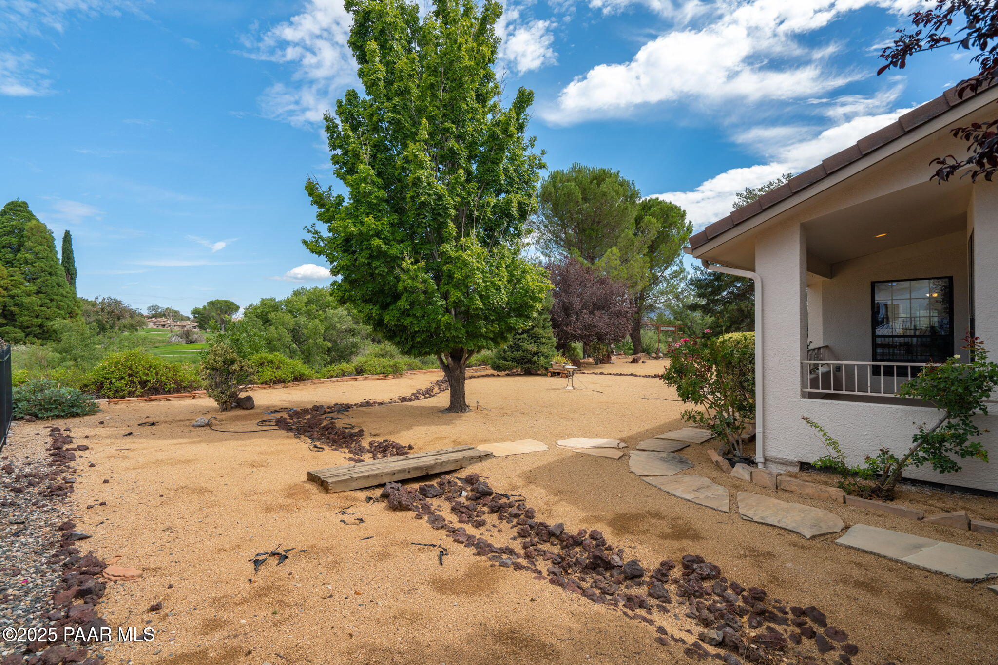 11452 East Turquoise Circle Dewey, AZ 86327 - Photo 42 of 68 a view of a yard with plants and trees