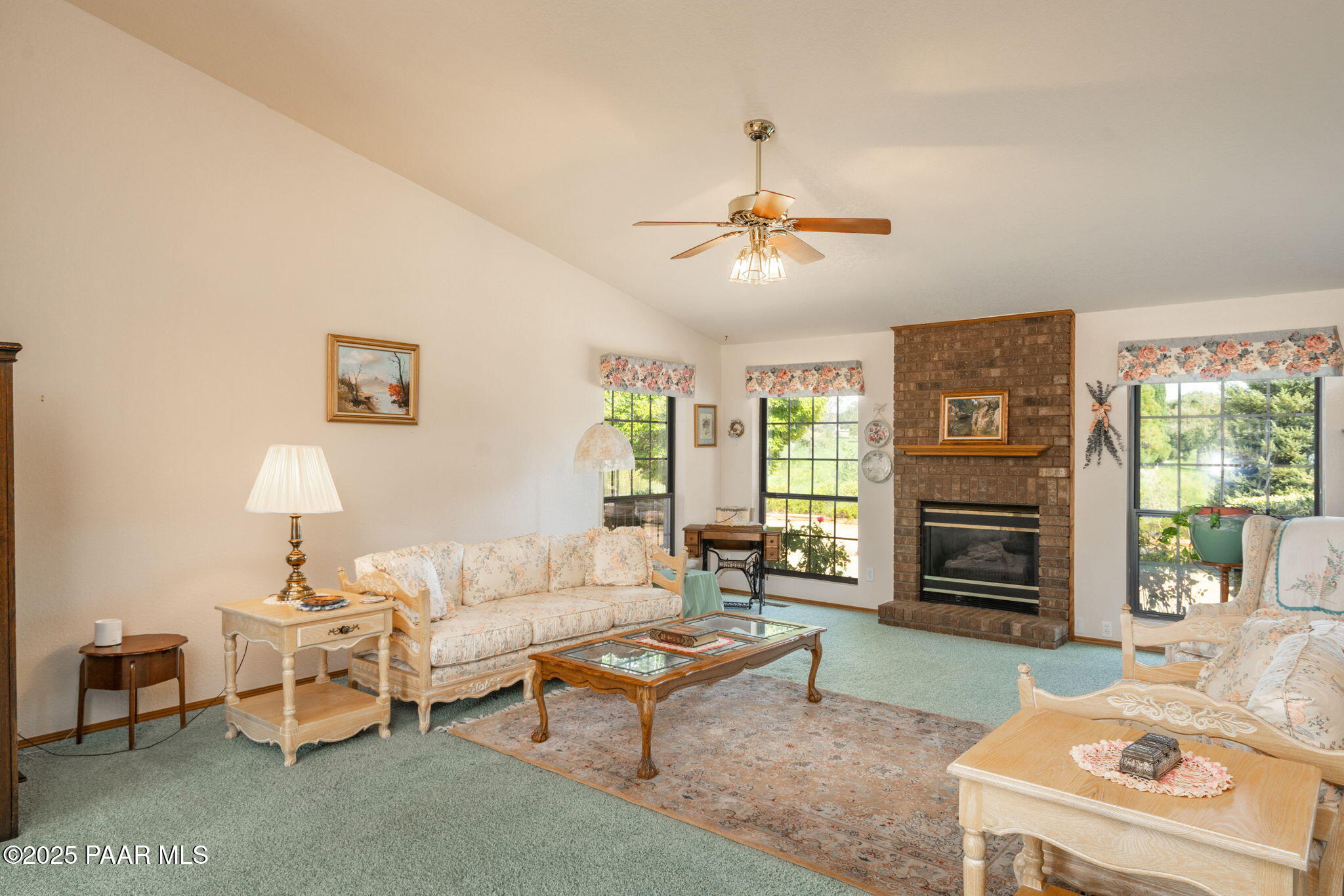 11452 East Turquoise Circle Dewey, AZ 86327 - Photo 5 of 68 a living room with furniture a fireplace and a flat screen tv