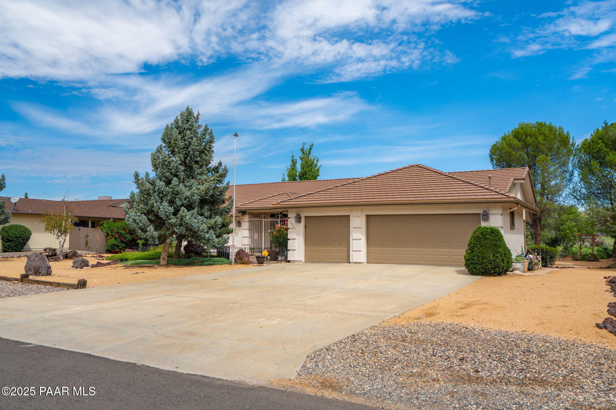 11452 East Turquoise Circle Dewey, AZ 86327 - Photo 51 of 68 a view of a brick house with a yard
