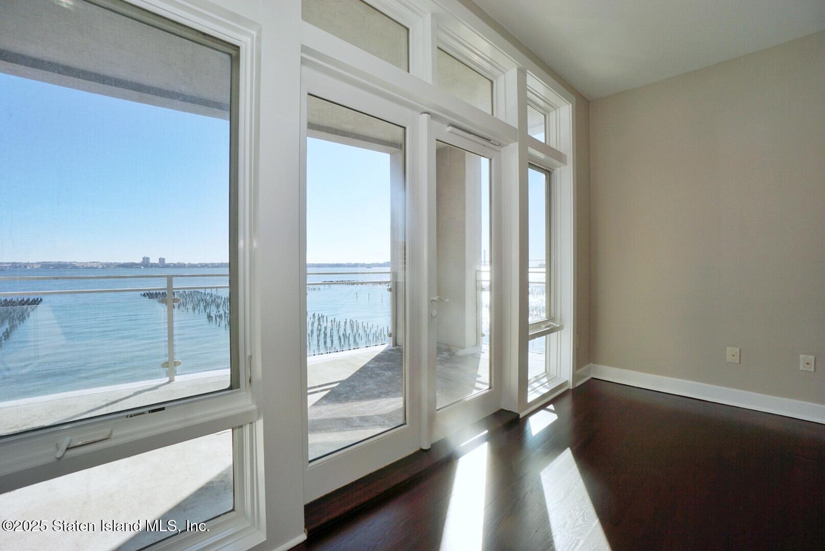 90 Bay Street Landing, Unit 4B Staten Island, NY 10301 - Photo 23 of 42 a view of empty room with wooden floor