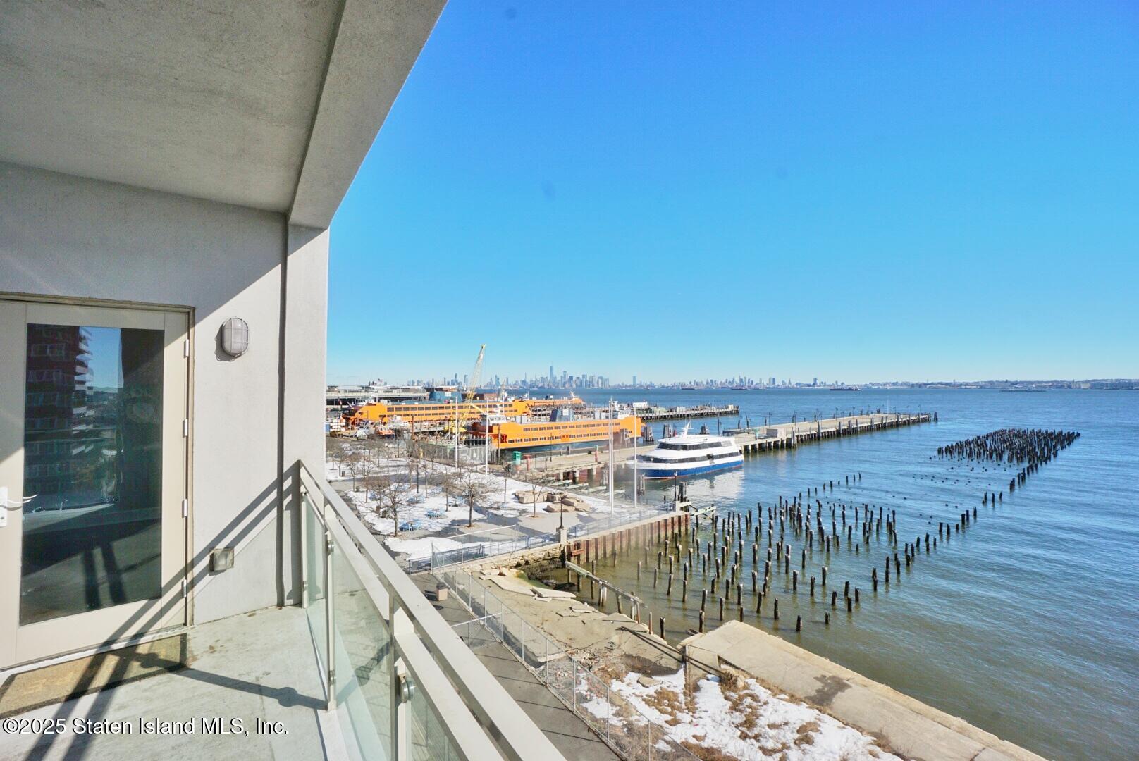 90 Bay Street Landing, Unit 4B Staten Island, NY 10301 - Photo 26 of 42 a view of a balcony with an ocean view