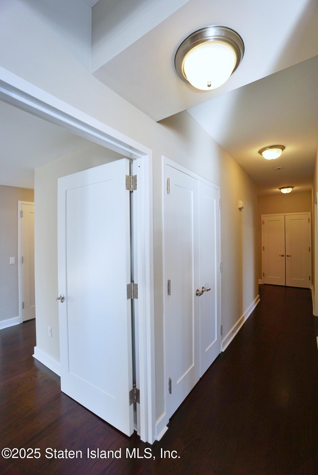 90 Bay Street Landing, Unit 4B Staten Island, NY 10301 - Photo 5 of 42 a view of a room with wooden floor