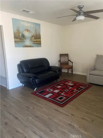 a living room with furniture and a rug