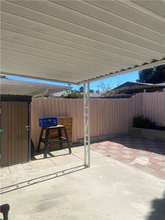 a view of a backyard with furniture