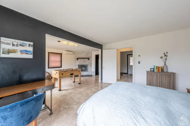 a bedroom with a bed and a dresser