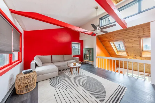 a view of swimming pool with red chair