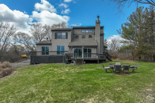 aerial view of a house with outdoor seating
