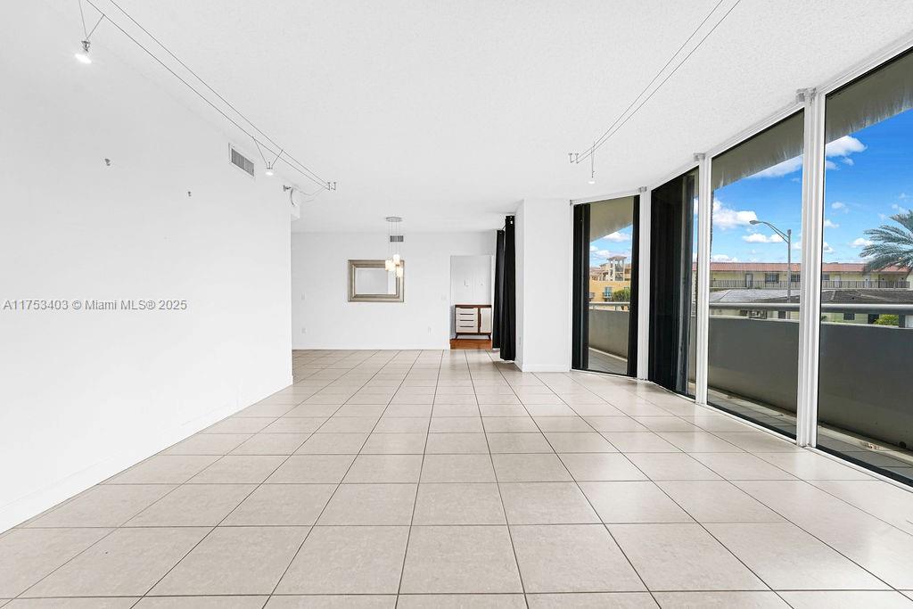 8925 Collins Avenue, Unit 2E Surfside, FL 33154 - Photo 13 of 46 a view of an empty room with a window