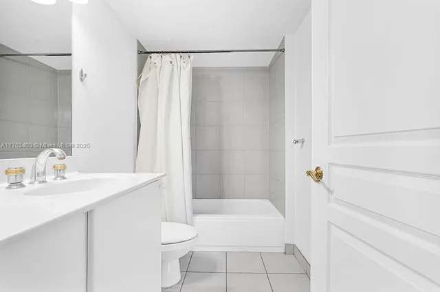 a room with a bed and a window