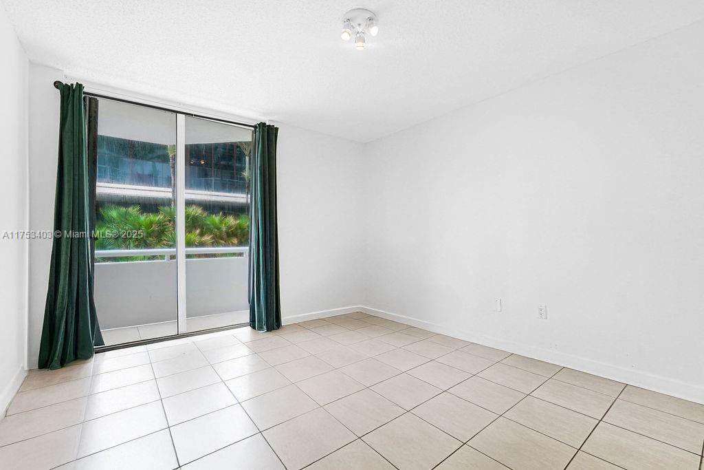 8925 Collins Avenue, Unit 2E Surfside, FL 33154 - Photo 18 of 46 a view of an empty room with a window