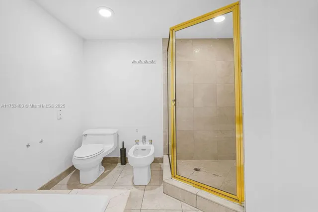 a large white kitchen with a sink and cabinets