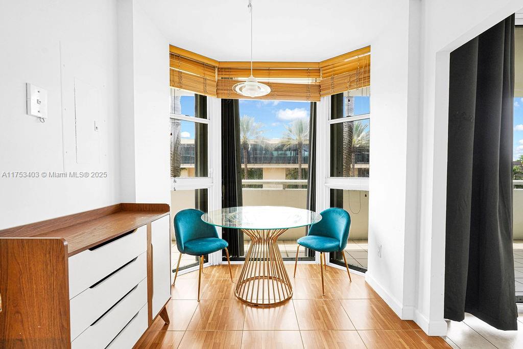 8925 Collins Avenue, Unit 2E Surfside, FL 33154 - Photo 30 of 46 a balcony with table and chairs