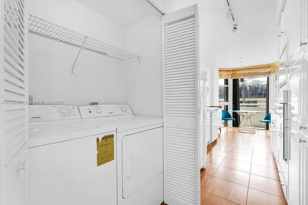 a utility room with dryer and washer