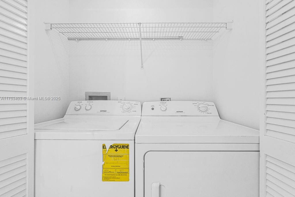 8925 Collins Avenue, Unit 2E Surfside, FL 33154 - Photo 33 of 46 a utility room with dryer and washer