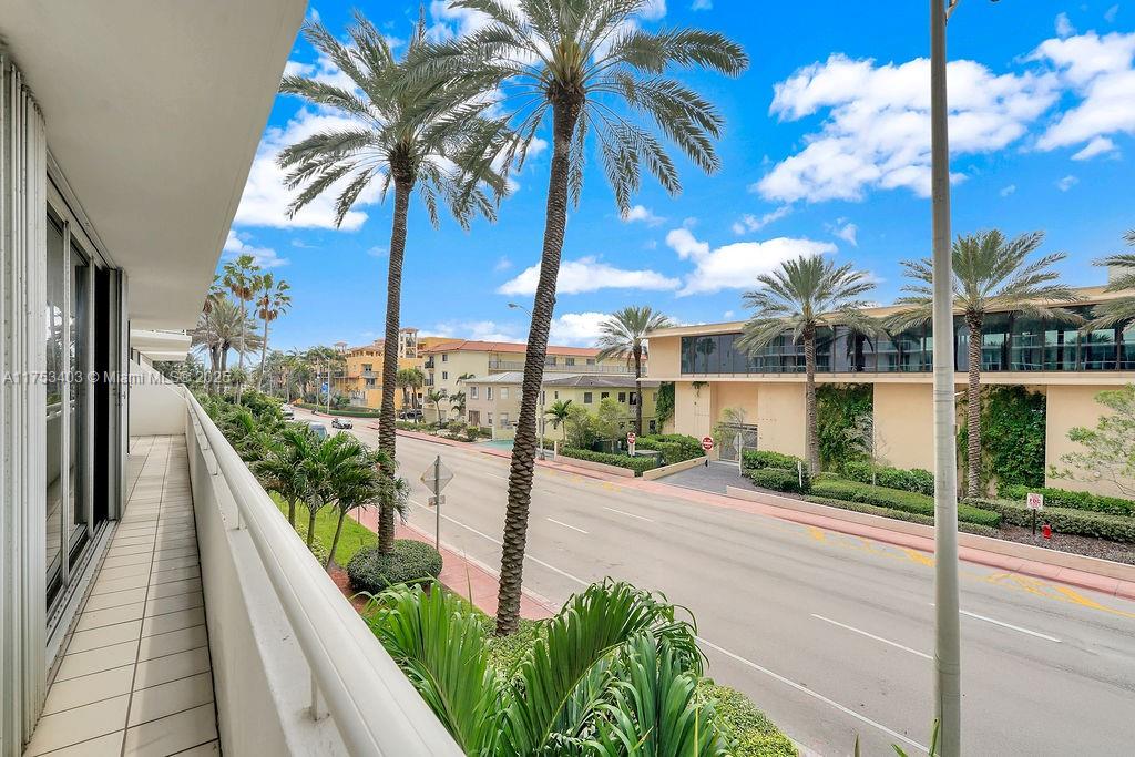 8925 Collins Avenue, Unit 2E Surfside, FL 33154 - Photo 35 of 46 a view of a balcony with palm trees