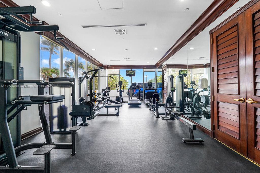 8925 Collins Avenue, Unit 2E Surfside, FL 33154 - Photo 39 of 46 a view of a room with gym equipment