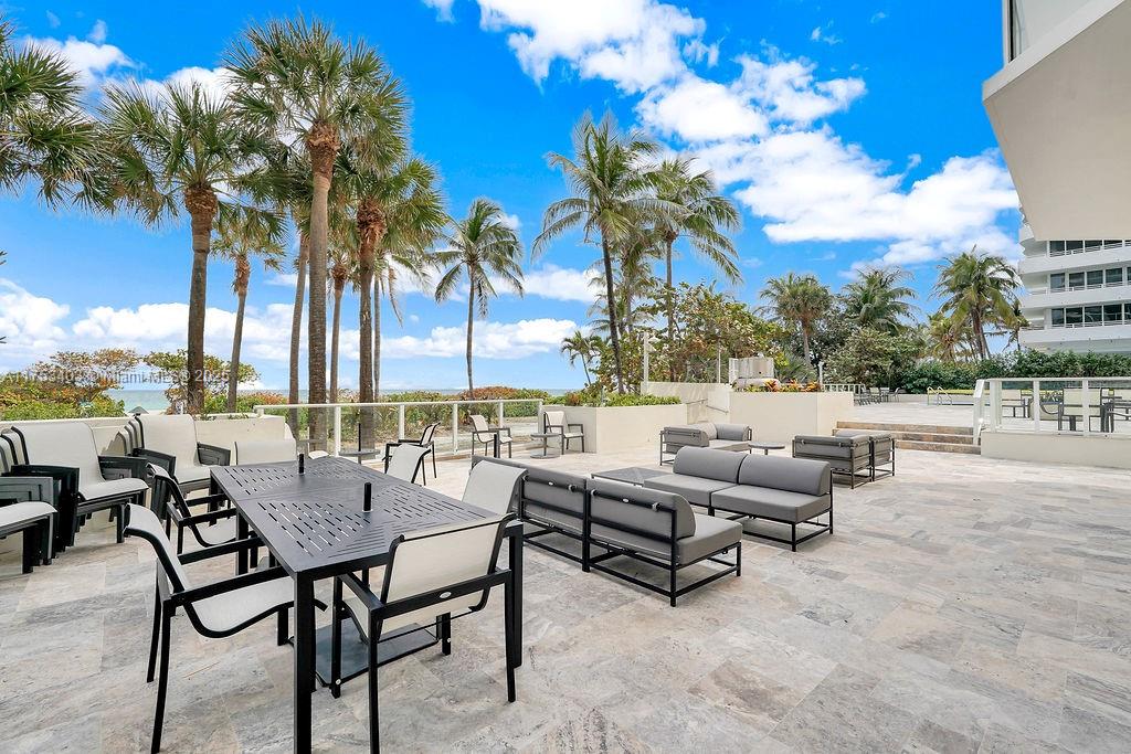 8925 Collins Avenue, Unit 2E Surfside, FL 33154 - Photo 44 of 46 a view of outdoor space with seating area and city view