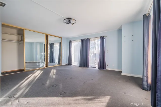 a view of a room with large windows