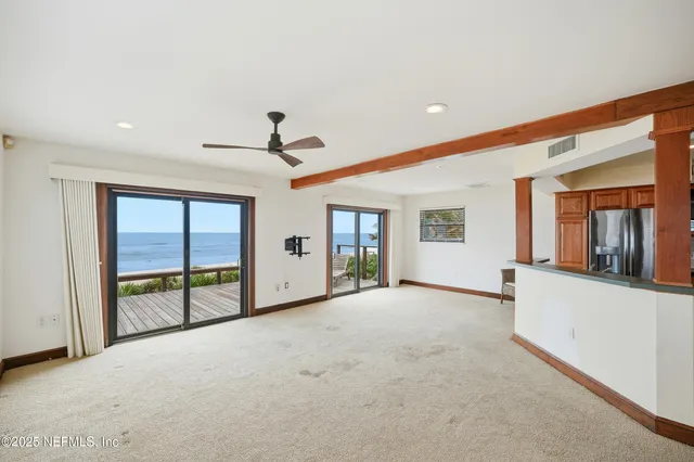 a open kitchen with a sink and large window