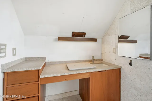 a front view of a house with a balcony