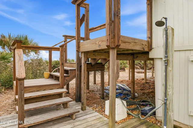 a view of a garden with an ocean view