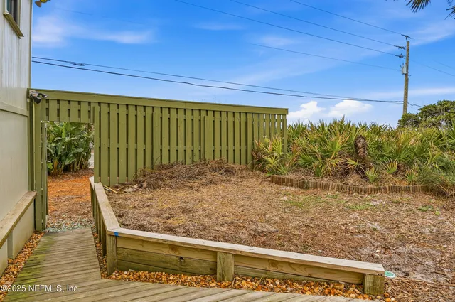 a view of a lake with a house in the background