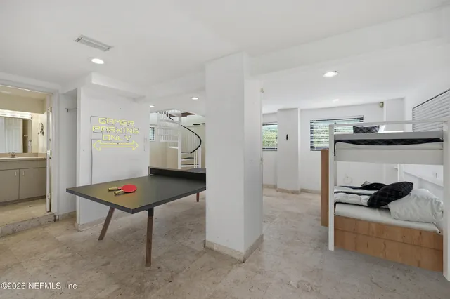 a view of staircase with white walls and a window