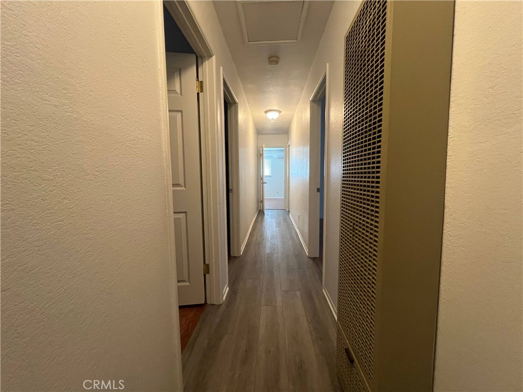 15558 Del Rey Drive Victorville, CA 92395 - Photo 13 of 32 a view of hallway with wooden floor