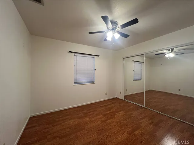 a view of an empty room with a fan